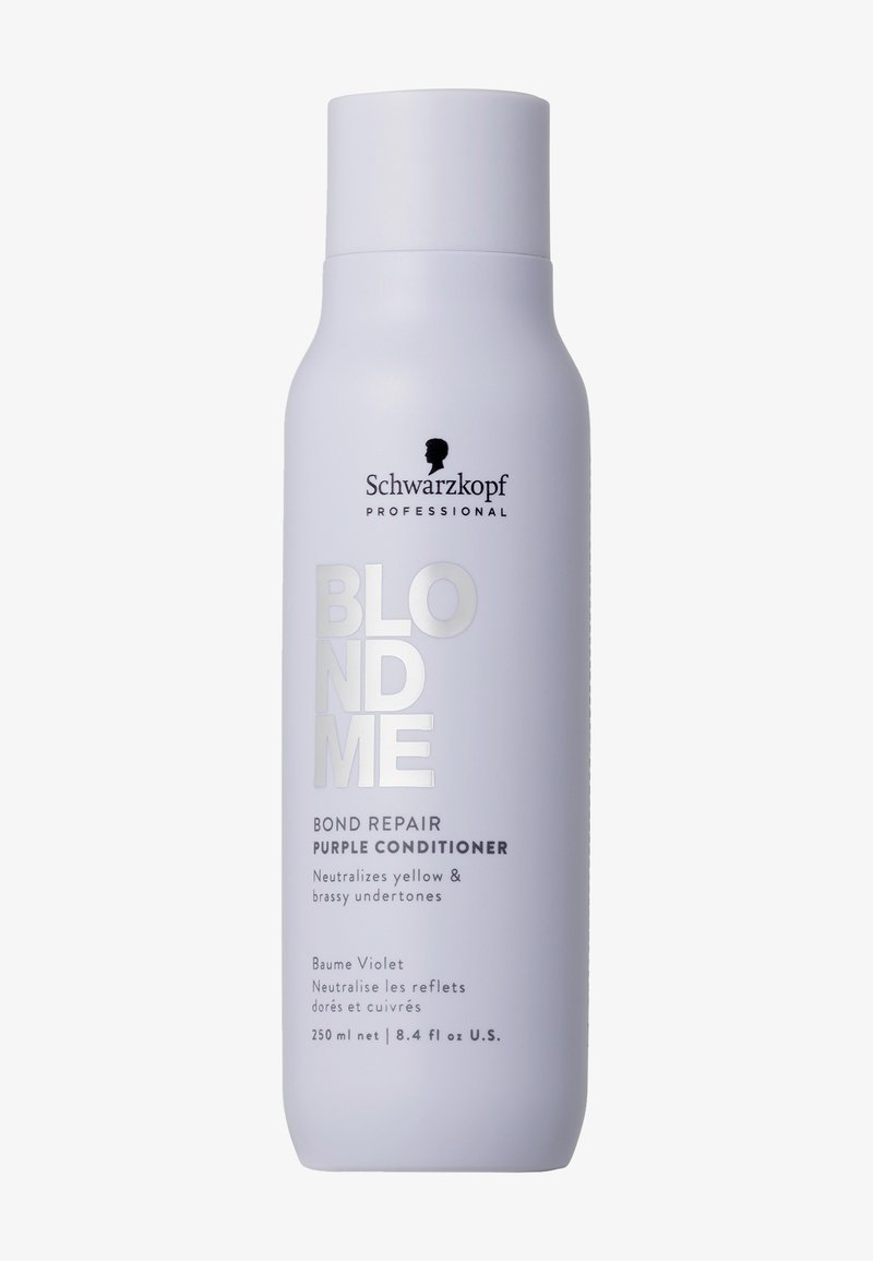 Schwarzkopf Blondme Purple Conditioner i en hög, vit, matt flaska med silvertext. Innehåller detaljer för att neutralisera gula undertoner.