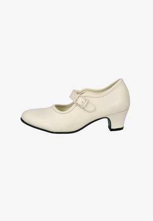 Zapato estilo Mary Jane de color blanco de piel, con tacón bajo, punta redonda y correa ajustable que presenta un pequeño detalle de hebilla.
