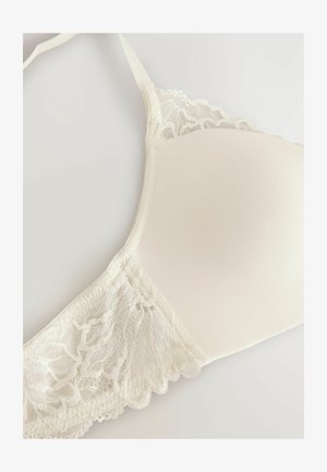 sujetador con aros en suave tela color crema con paneles laterales de encaje, bordes con forma de ola y tirantes ajustables para un ajuste seguro.