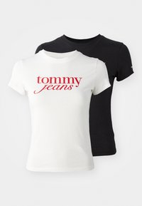 Du švarkai: vienas baltas su raudonu "tommy jeans" tekstu, o kitas juodas. Abu turi prigludusią formą ir trumpas rankoves. Pagaminti iš medvilnės.