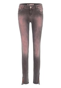 Jean skinny de couleur noir délavé avec une légère teinte rose. Doté d'une fermeture éclair à la cheville et de détails à l'ourlet effiloché. Fabriqué en denim.
