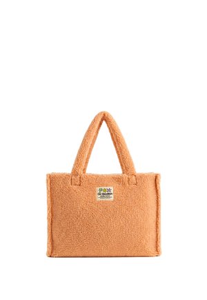 Bolso tote rectangular naranja suave con asas cortas y una pequeña etiqueta temática de vacaciones en el centro delantero.