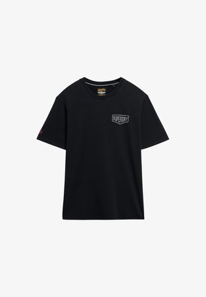 Zwarte katoenen T-shirt met een ronde hals, korte mouwen en een klein wit "SUPERDRY" logo op de borst. Glad materiaal, reguliere pasvorm.