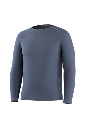 Niebieska, bezszwowa, sportowa koszulka z długim rękawem, okrągłym dekoltem, subtelnymi wzorami wentylacyjnymi oraz małym logo na lewym rękawie.