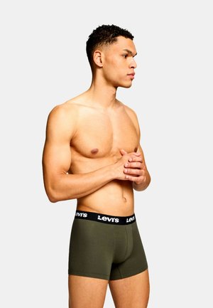 Olijfgroene boxershorts met een zwarte Levi's tailleband, voorzien van een aansluitende pasvorm en zachte textuur, gedragen door een mannelijk model van de zijkant.