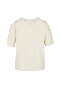 Cream-colored cotton t-shirt with short sleeves, a round neckline, and a relaxed fit. Smooth texture with minimal stitching details.
