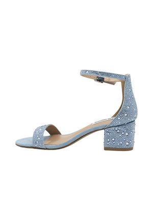 Light blue suede sandal with block heel and ankle strap, embellished with small round rhinestones for a sparkling effect.