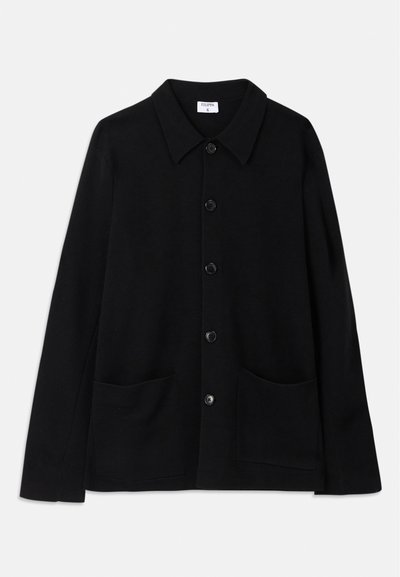 Black button-up jacket with a collar, two front pockets, and a textured fabric. Features five buttons down the front.
