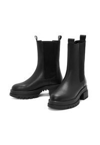 Black leather ankle boots with elastic side panels, rounded toe, and chunky rubber sole featuring treads for grip.