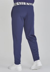 SIKSILK TAPERED FIT JOGGERS - Tracksuit bottoms - navy