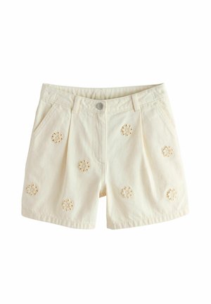 Cream-colored shorts with front pockets and embroidered floral cutout designs scattered across the fabric.