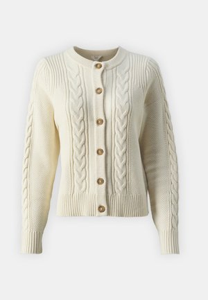 Cable-knit cream cardigan featuring textured patterns, a round neckline, and five brown buttons down the front, with ribbed cuffs and hem.