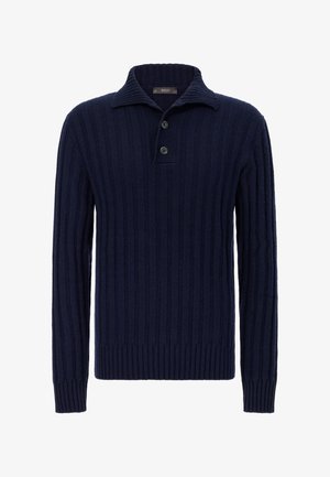 Laivastonsininen ribbineulottu paita, jossa on klassinen kaulus, kolmen napin etukappale ja pitkät hihat. Siinä on teksturoitu kangas ja vartalonmyötäinen helma.