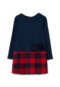 Navyblaues Langarmkleid mit einem plissierten Rock in rot-schwarzem Karomuster und einer passenden navyblauen Schleife an der Taille.