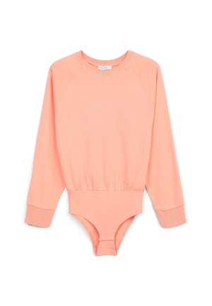 Bodysuit à manches longues raglan en coton doux pêche. Doté d'un col côtelé, de poignets ajustés et d'une fermeture à boutons-pression en bas. Texture lisse.