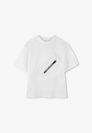T-shirt en coton blanc à manches courtes avec une poche latérale dotée d'une fermeture éclair noire et de la marque "MARC JACOBS". Texture lisse, coupe décontractée.
