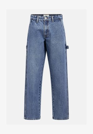 Blaue gerade geschnittene Denim-Jeans mit Gürtelschlaufen, vorderem Knopf- und Reißverschluss sowie seitlicher Werkzeugschlaufe am rechten Bein.