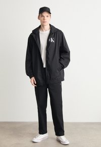 Calvin Klein Jeans CROPPED - Pantaloni - black