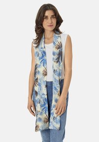Lightweight scarf featuring a tropical palm leaf pattern in blue, beige, and brown tones, with a smooth finish and long, flowing design.