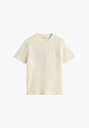 Plain off-white short-sleeve cotton t-shirt with crew neck and subtle brand label on chest, displayed on a white background.