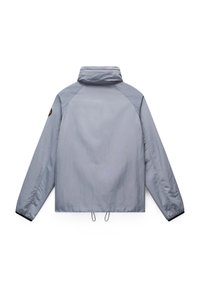 Light gray, water-resistant jacket with a high collar, elastic cuffs, and adjustable hem. Features a logo patch on the sleeve and a smooth texture.