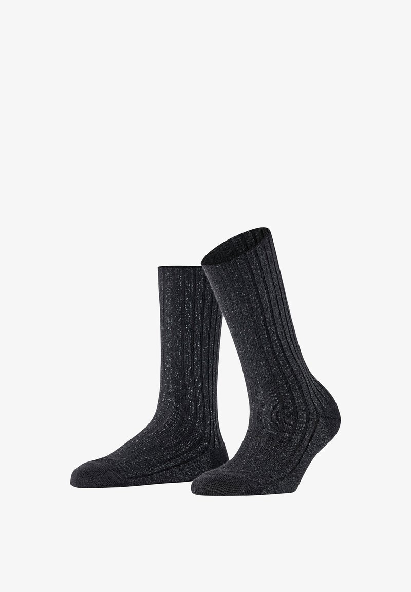 Schwarze gerippte Socken mit leichtem Glanz, ausgestattet mit einer glatten Zehenpartie und verstärktem Fersenbereich. Entworfen für Komfort und Langlebigkeit.