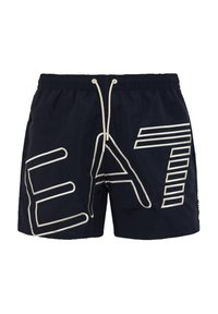 Marina badshorts med dragsnöre i midjan, featuring stora vita bokstäver "EAT" och randiga detaljer på vänster sida.