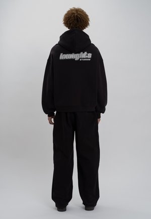 Tröja med dragkedja - black