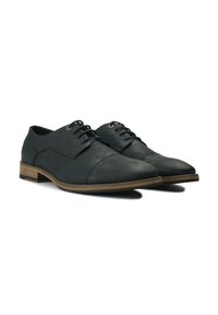 Black leather lace-up shoes with a rounded toe, textured upper, and brown wooden sole accents, featuring standard eyelets for laces.
