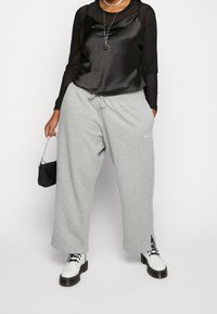 Nike Sportswear Träningsbyxor - grey