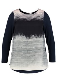 Pitkähihaisen paidan väri-/taittopainatuksessa on harmaan abstract-tyylinen printti edessä ja tummansiniset hihat. Pehmeää kangasta, pyöreä kaula-aukko.