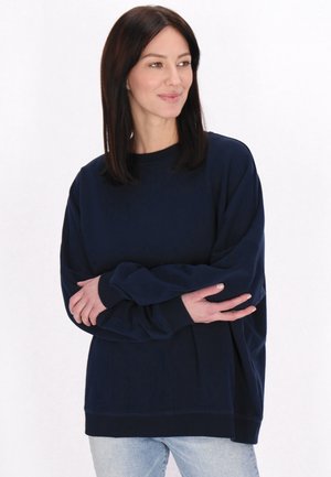 Marineblaues Sweatshirt mit Rundhalsausschnitt, langen Ärmeln und lockerer Passform. Hergestellt aus weichem, strukturiertem Stoff mit einem gerippten Saum.