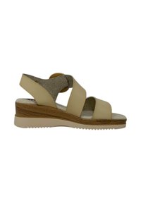 Sandali con zeppa beige, con cinturini, suola in legno e soletta testurizzata. Cinturino alla caviglia regolabile e soletta imbottita per il comfort.