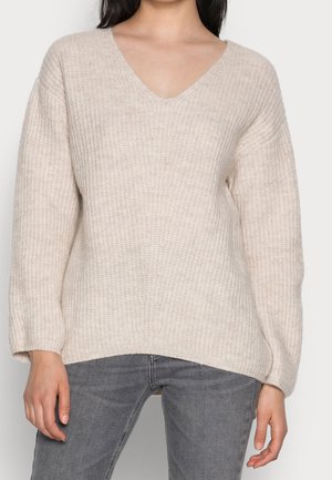 Stickad tröja - beige