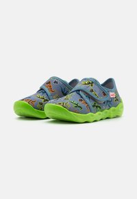 Blue fabric shoes with green soles, featuring a dinosaur print in orange, yellow, and green. Designed with two Velcro straps for easy wear.
