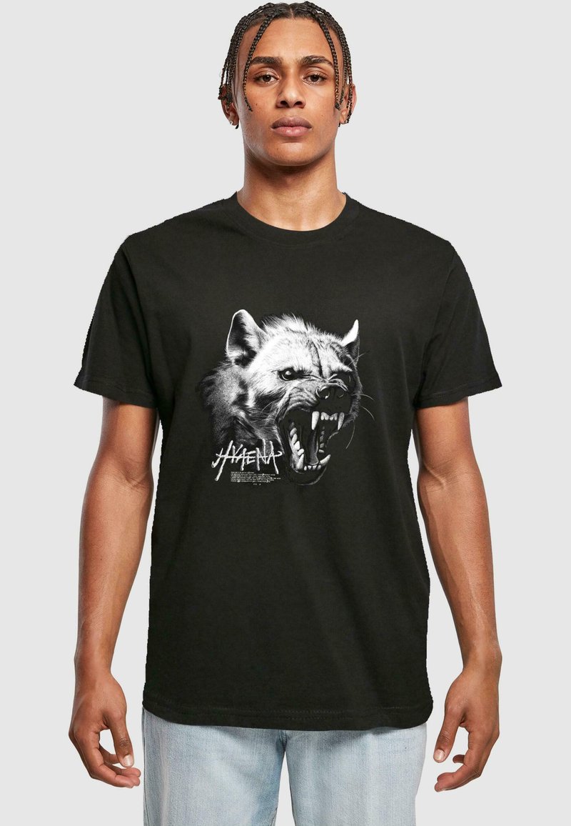 Black cotton T-shirt featuring a detailed graphic of a hyena's face, showcasing sharp teeth and fur texture with bold lettering beneath.