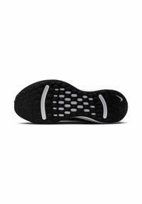 Sole di sneaker nera con superficie in gomma testurizzata caratterizzata da motivi circolari e ovali, accentuata da sezioni bianche e un logo.