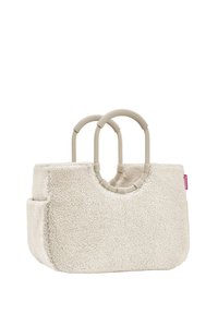 Beige Fake-Shearling-Taschen mit abgerundetem oberen Ende, texturierten Oberfläche und zwei runden, beigen Griffen. Verfügt über eine Seitentasche und ein kleines Markenschild.