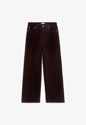 Dunkelbraune, weit geschnittene Cordhosen mit vorderem Knopf und Reißverschluss, Gürtelschlaufen und Fünf-Taschen-Design.