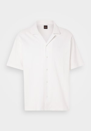 White short-sleeve shirt made of textured fabric. Features a button front and a notch collar; subtle logo detail on the chest.