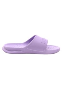 Light purple slide sandal with a textured footbed and smooth upper strap. The brand logo is embossed on the strap. Soft, flexible material.