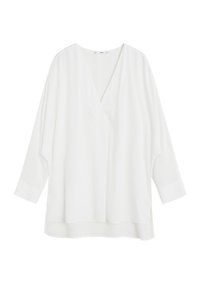 Blusa bianca leggera con scollo a V e vestibilità ampia. Presenta maniche lunghe e larghe e aperture laterali per una maggiore libertà di movimento. Texture liscia.