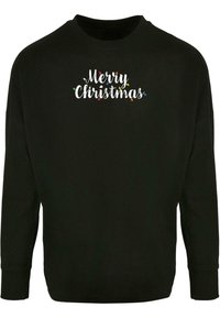 Svart langermet sweatshirt med teksten "God Jul" i hvit skrift, utsmykket med fargerike julelys i et festlig design.