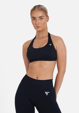EVE SEAMLESS HALTER  - Športni modrček s srednjo podporo - black