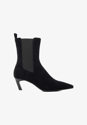 Black ankle boot featuring a pointed toe, suede material, elastic side panels, and a slim, angled heel.