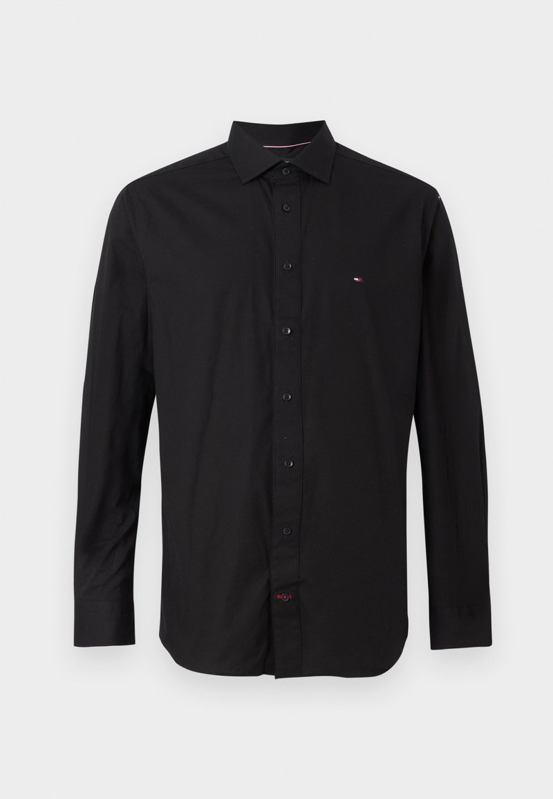 Black long-sleeve shirt made of cotton, featuring a button-down collar, front buttons, and a small logo on the chest. Smooth texture.