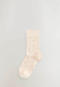 Beige Sock mit gerippter Textur und kleinen rosa Punkten, mit verstärkter Zehen- und Bündchenpartie für Langlebigkeit.