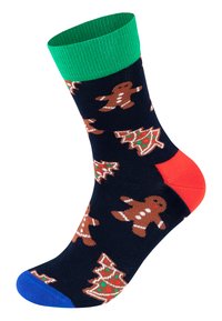 Calcetines marinos con puño acanalado verde, talón rojo y puntera azul. Presentan un patrón festivo con hombres de jengibre y árboles de Navidad.
