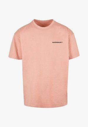 Hellrosa T-Shirt mit kurzen Ärmeln und Rundhalsausschnitt mit kleinem schwarzem Text „MJGONZALES™“ auf der linken Brust.