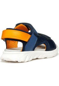 Sandals featuring a blue and orange synthetic upper, white sole, adjustable Velcro straps, and a textured insole for comfort.